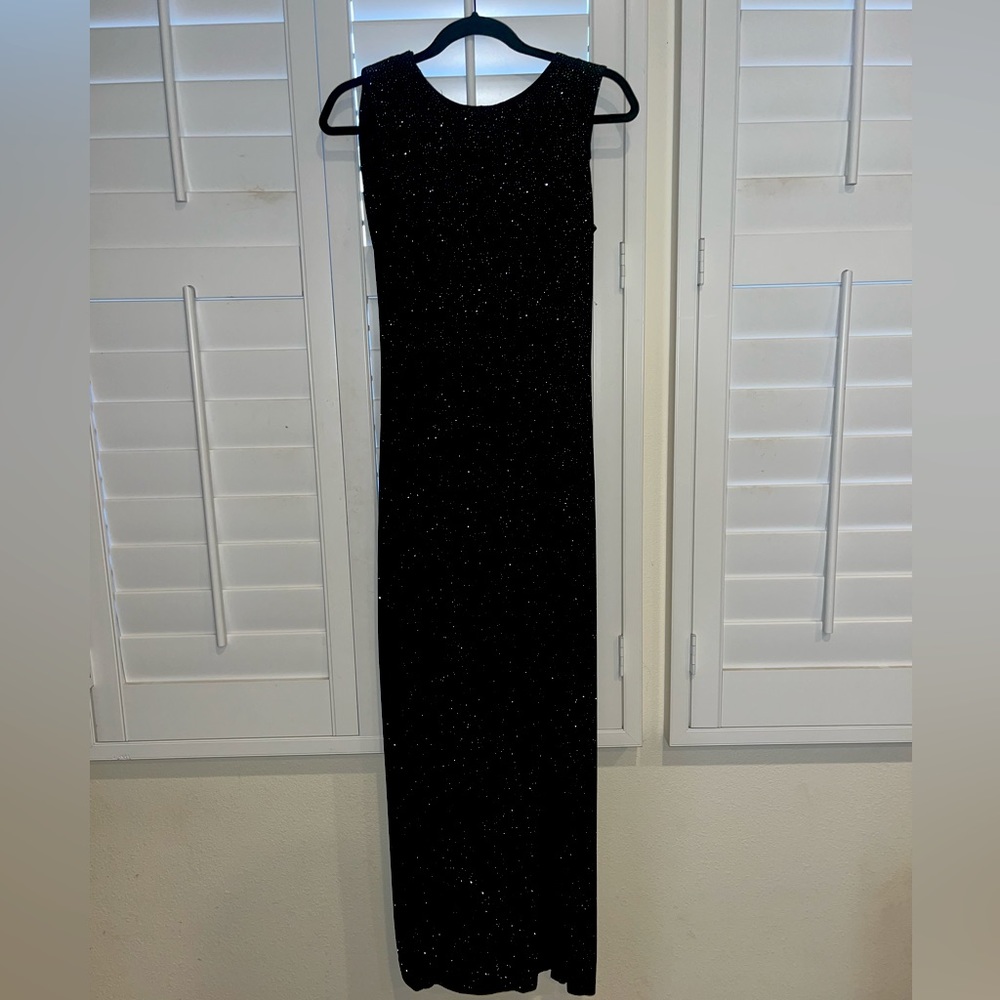 Betsy & Adam Black sparkling gown with a low back.